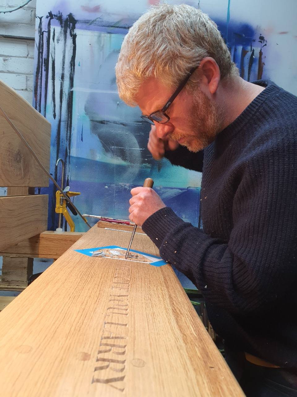 Peter Houghton carving at his workshop bench