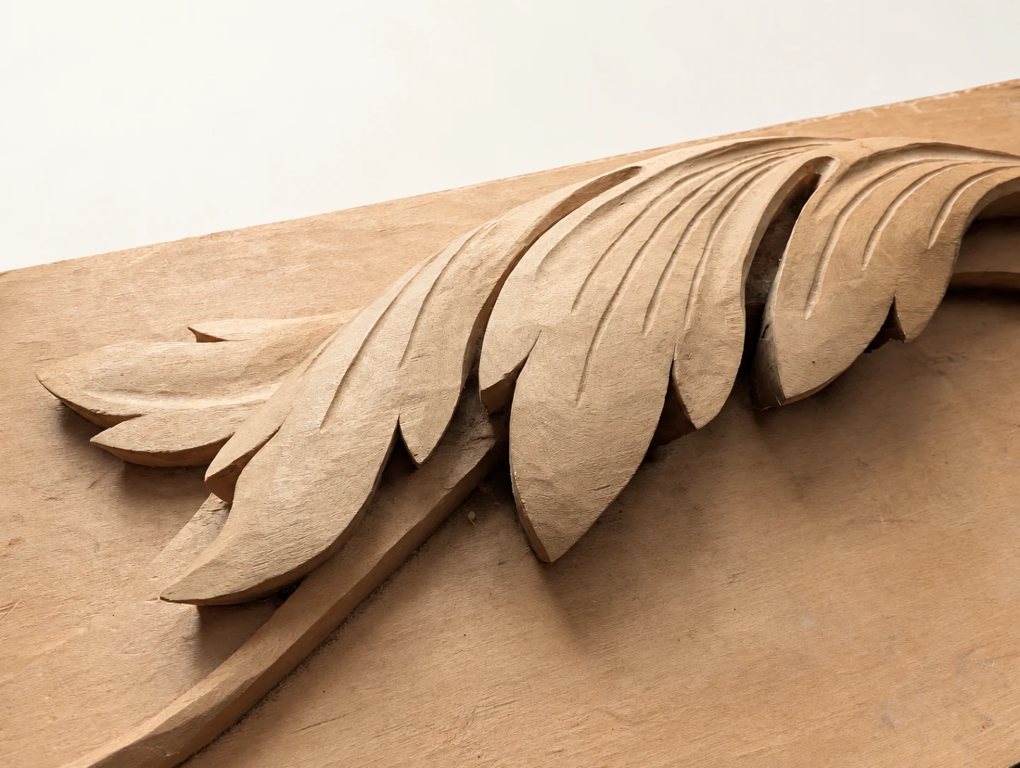 Close angled view of the carved acanthus leaves and incised veins
