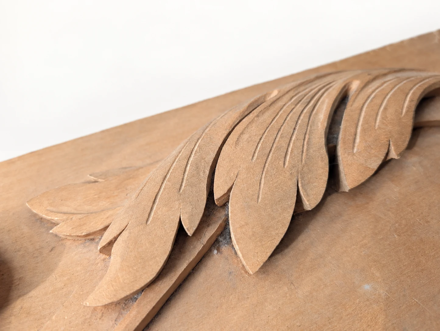 Second close view of the carved leaf edges and tool marks