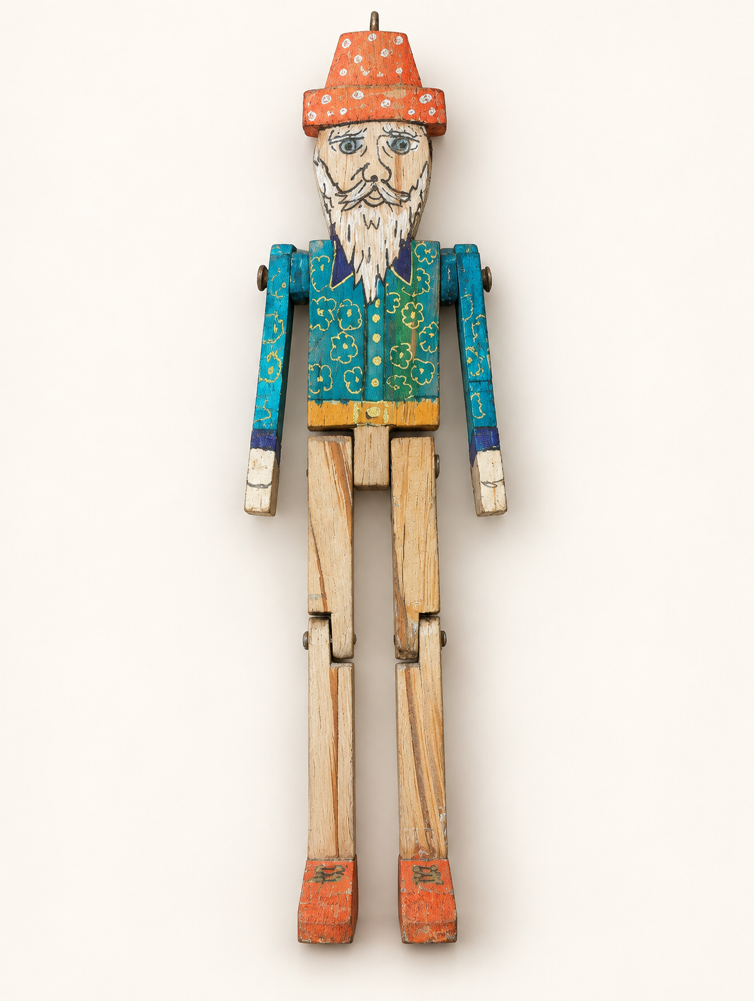 Full wooden Banjo Puppet with painted blue body and articulated limbs on an off-white background
