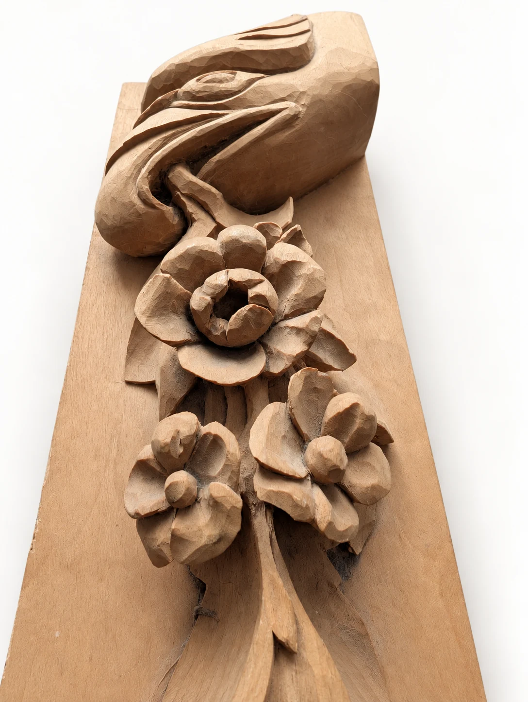 Close angled detail of the carved flowers and scroll
