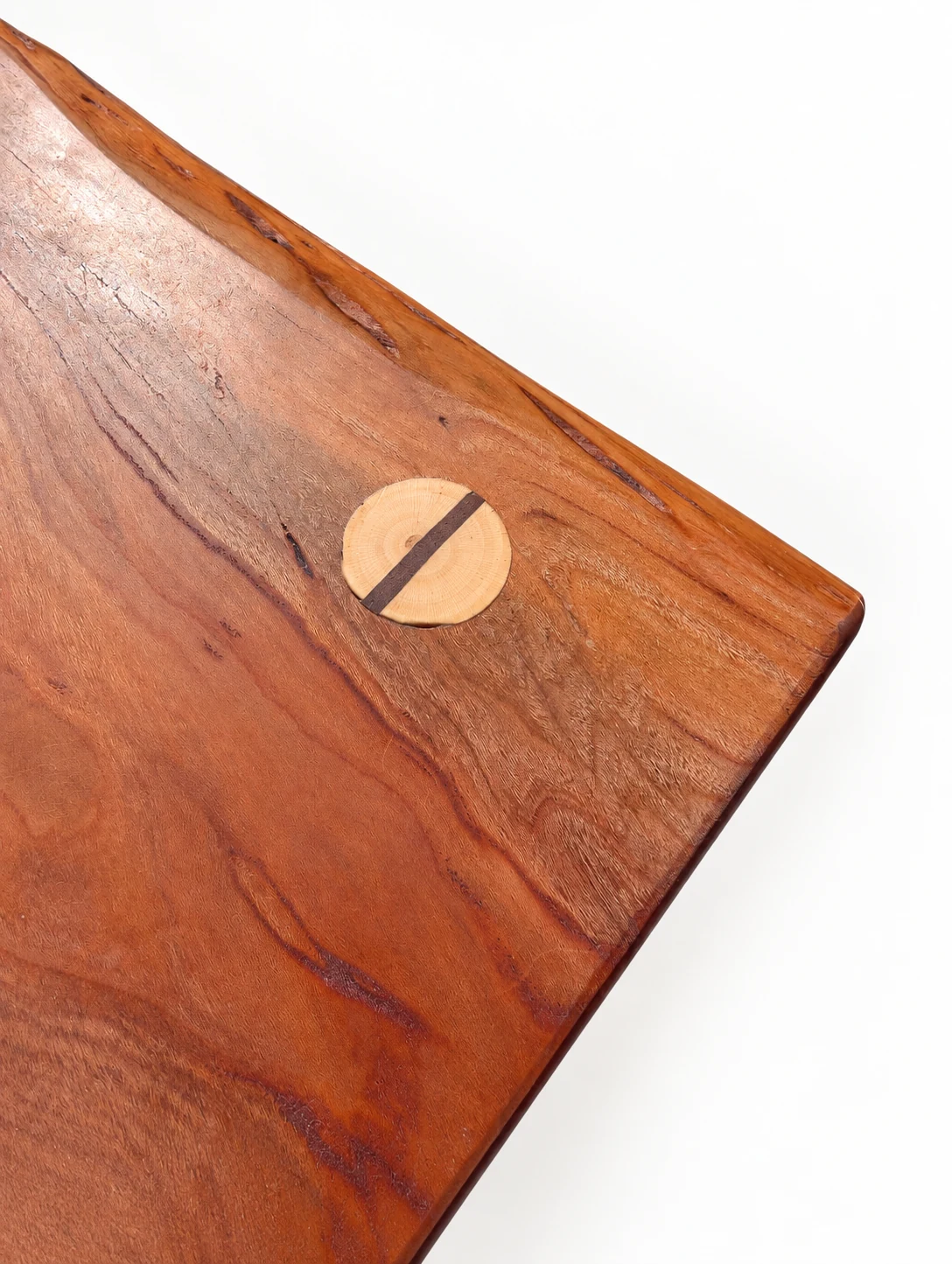 Angled close detail of the stool seat and contrasting joint