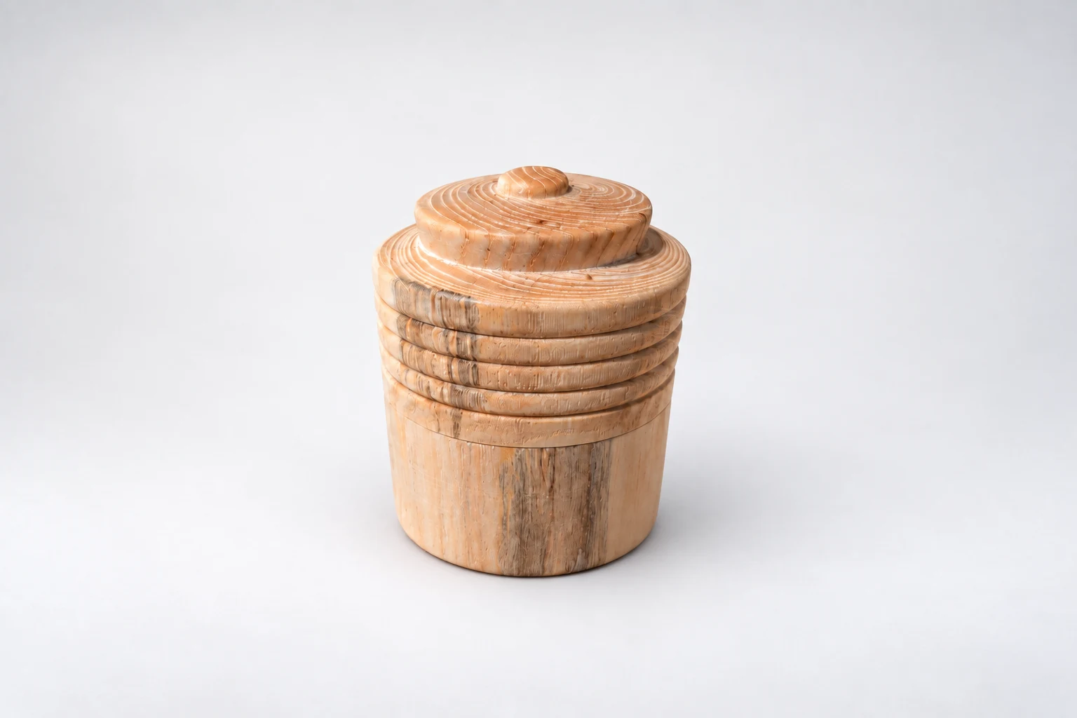 Small wooden lidded vessel with decorative horizontal grooves